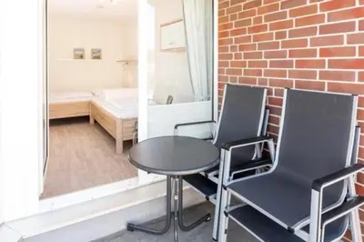 Ein Bett oder Betten in einem Zimmer der Unterkunft Hohe Worth, H303