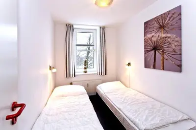 Ein Bett oder Betten in einem Zimmer der Unterkunft Hohe Worth, H213