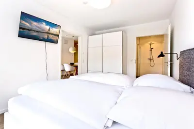 Ein Bett oder Betten in einem Zimmer der Unterkunft Duhner Spitze, DS54
