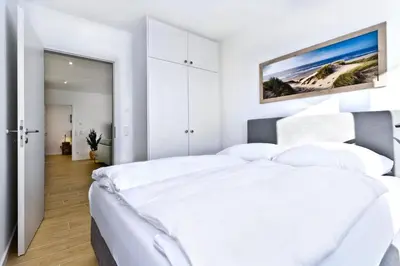Ein Bett oder Betten in einem Zimmer der Unterkunft Duhner Spitze, DS18