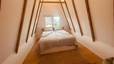 Ein Bett oder Betten in einem Zimmer der Unterkunft Ferienhaus Nordsee Nest