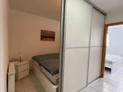 Ein Bett oder Betten in einem Zimmer der Unterkunft Haus Dortmund, Whg 18