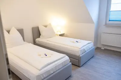 Ein Bett oder Betten in einem Zimmer der Unterkunft Neu renoviertes Luxus Penthouse mit Dachterrasse und Parkplatz in Bestlage