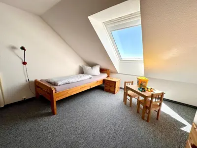 Ein Bett oder Betten in einem Zimmer der Unterkunft Ferienwohnung De Klüver