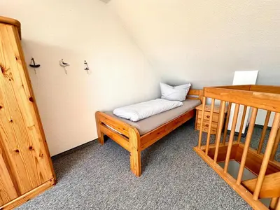 Ein Bett oder Betten in einem Zimmer der Unterkunft Ferienwohnung De Klüver