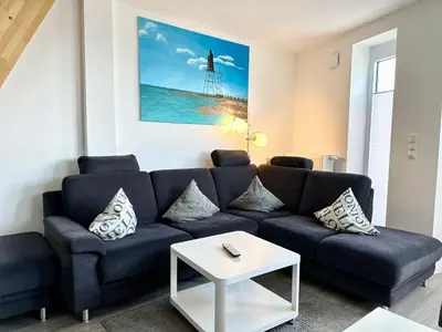 Ein Sitzbereich in der Unterkunft Ferienwohnung De Föhr