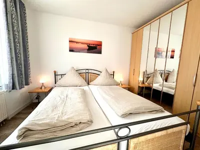 Ein Bett oder Betten in einem Zimmer der Unterkunft Ferienwohnung De Brecker