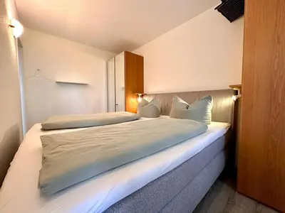 Ein Bett oder Betten in einem Zimmer der Unterkunft Ferienwohnung De Kiewitt 207