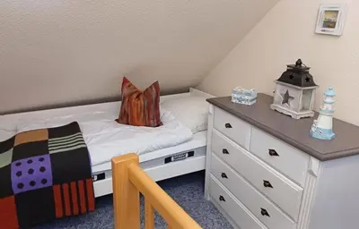 Ein Bett oder Betten in einem Zimmer der Unterkunft Ferienwohnung De Schuufut