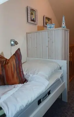 Ein Bett oder Betten in einem Zimmer der Unterkunft Ferienwohnung De Schuufut