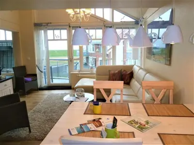 Ein Sitzbereich in der Unterkunft Ferienwohnung De Schuufut