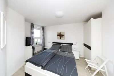 Ein Bett oder Betten in einem Zimmer der Unterkunft Ferienwohnung De Üützepogg