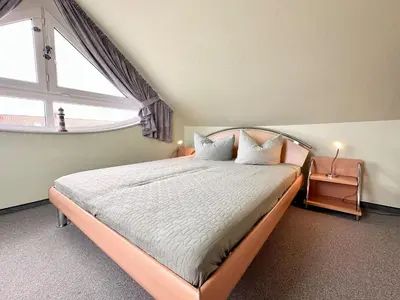 Ein Bett oder Betten in einem Zimmer der Unterkunft Ferienwohnung Suite de Svaan