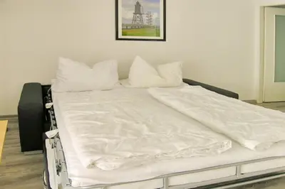 Ein Bett oder Betten in einem Zimmer der Unterkunft Ferienwohnung De Dwarslöper