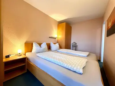 Ein Bett oder Betten in einem Zimmer der Unterkunft Ferienwohnung De Diek 105