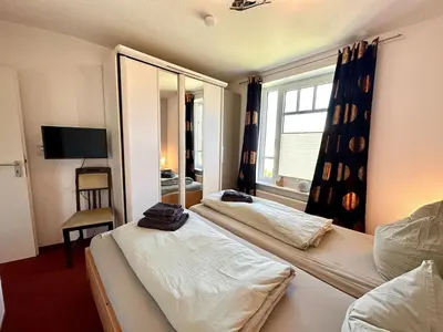 Ein Bett oder Betten in einem Zimmer der Unterkunft Ferienwohnung De Drückdaal