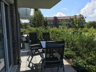 Ein Garten an der Unterkunft Ferienwohnung De Haagebutten