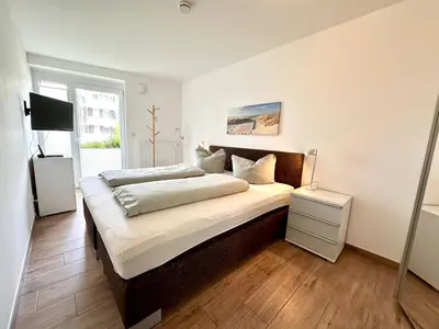 Ein Bett oder Betten in einem Zimmer der Unterkunft Ferienwohnung De Haagebutten