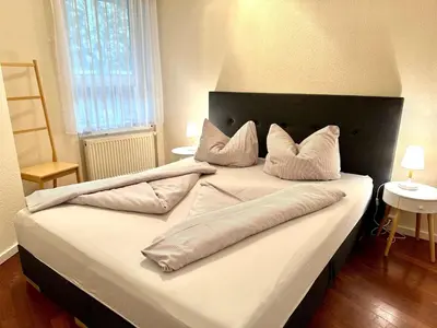 Ein Bett oder Betten in einem Zimmer der Unterkunft Ferienwohnung De Tied 106