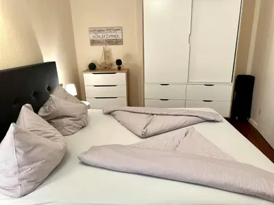 Ein Bett oder Betten in einem Zimmer der Unterkunft Ferienwohnung De Tied 106