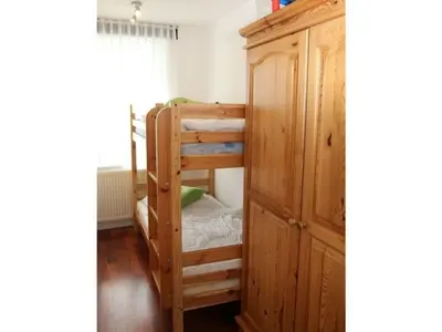 Ein Bett oder Betten in einem Zimmer der Unterkunft Ferienwohnung De Tied 106