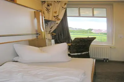 Ein Bett oder Betten in einem Zimmer der Unterkunft Ferienwohnung De Keef
