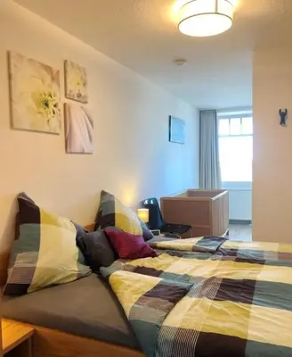 Ein Bett oder Betten in einem Zimmer der Unterkunft Ferienwohnung De Robb