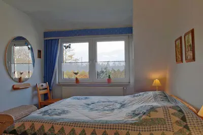 Ein Bett oder Betten in einem Zimmer der Unterkunft SI30v FeWo Stör