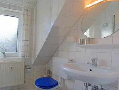 Ein Badezimmer in der Unterkunft SI30v FeWo Stör