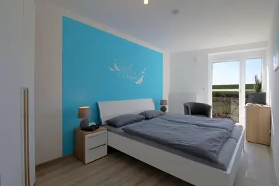 Ein Bett oder Betten in einem Zimmer der Unterkunft de Seedüwel Carna 101