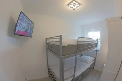 Ein Bett oder Betten in einem Zimmer der Unterkunft KW4a Haus Leni