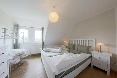 Ein Bett oder Betten in einem Zimmer der Unterkunft MU32a Dachgeschoss mit Gartenanteil