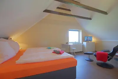 Ein Bett oder Betten in einem Zimmer der Unterkunft Gästehaus Dorum 05