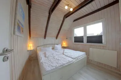 Ein Bett oder Betten in einem Zimmer der Unterkunft SE Robbenplate 19