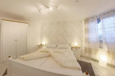 Ein Bett oder Betten in einem Zimmer der Unterkunft LT 33 Bungalow Manu