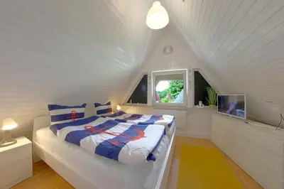 Ein Bett oder Betten in einem Zimmer der Unterkunft SR Knechtsand 2