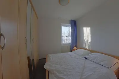 Ein Bett oder Betten in einem Zimmer der Unterkunft Haus Amrum WE 14