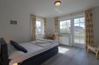 Ein Bett oder Betten in einem Zimmer der Unterkunft MU2 Ferienhaus mit Sauna