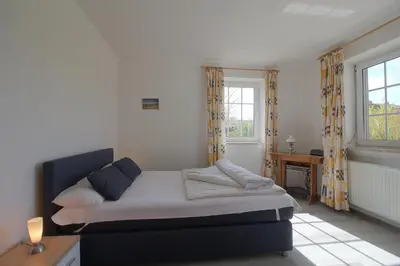 Ein Bett oder Betten in einem Zimmer der Unterkunft MU2 Ferienhaus mit Sauna