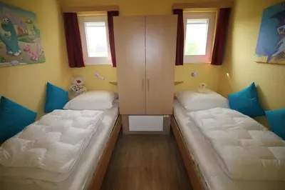 Ein Bett oder Betten in einem Zimmer der Unterkunft Strandnixe Mellumplate 7