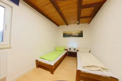 Ein Bett oder Betten in einem Zimmer der Unterkunft Dat lütte Hus