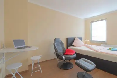 Ein Bett oder Betten in einem Zimmer der Unterkunft Gästehaus Dorum 01