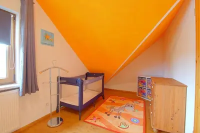 Ein Bett oder Betten in einem Zimmer der Unterkunft KW21a Ferienhaus Silbermöwe