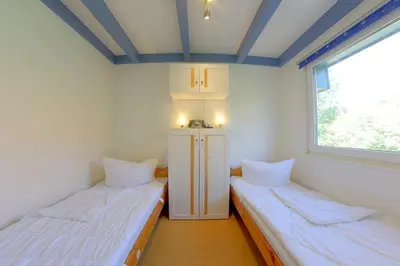 Ein Bett oder Betten in einem Zimmer der Unterkunft Stb Wittsand 7