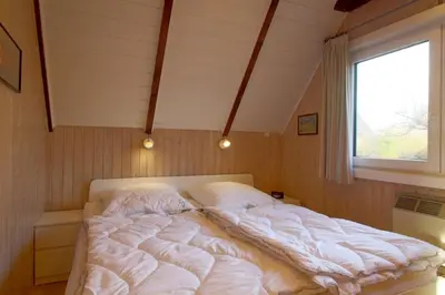 Ein Bett oder Betten in einem Zimmer der Unterkunft SE RP8 Ferienhaus am Wattenmeer