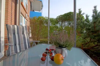 Ein Balkon oder eine Terrasse in der Unterkunft FeWo 07 - Haus Amrum