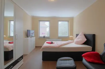 Ein Bett oder Betten in einem Zimmer der Unterkunft Gästehaus Dorum 02