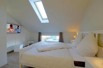 Ein Bett oder Betten in einem Zimmer der Unterkunft KW4c Haus Deichbrand
