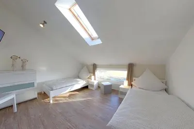 Ein Bett oder Betten in einem Zimmer der Unterkunft KW4c Haus Deichbrand