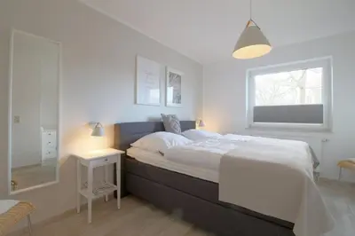 Ein Bett oder Betten in einem Zimmer der Unterkunft Lilli Marleen WE 04
